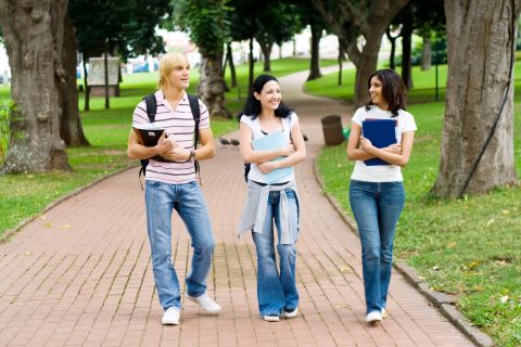 group of college students walking in campus